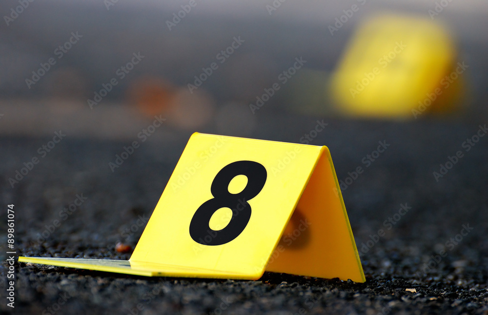 Crime Evidence Marker on Asphalt Crime Evidence Marker on Asphalt