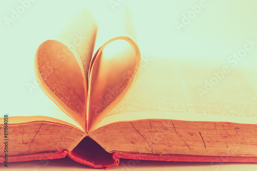 Soft focused heart from book pages, vintage tone process