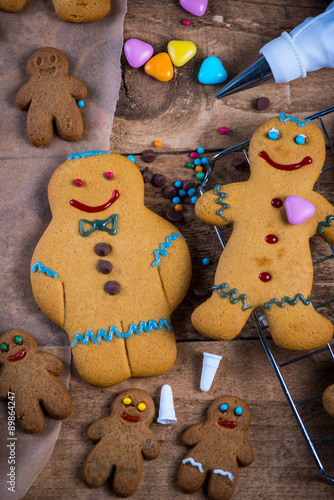 Decorating homemade gingerbread man for Christmas