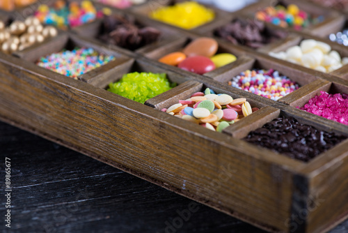 close view on sugar decoration in wooden box