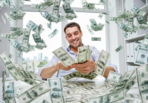 Canvas Print happy businessman with heap of money