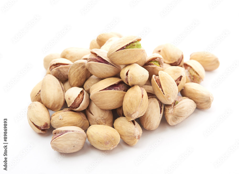 Heap of pistachios nuts isolated on the white