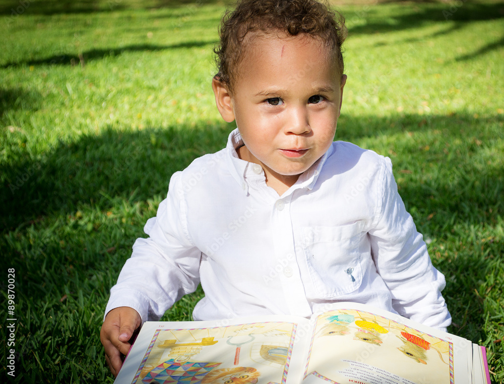 A little Boy with a book.