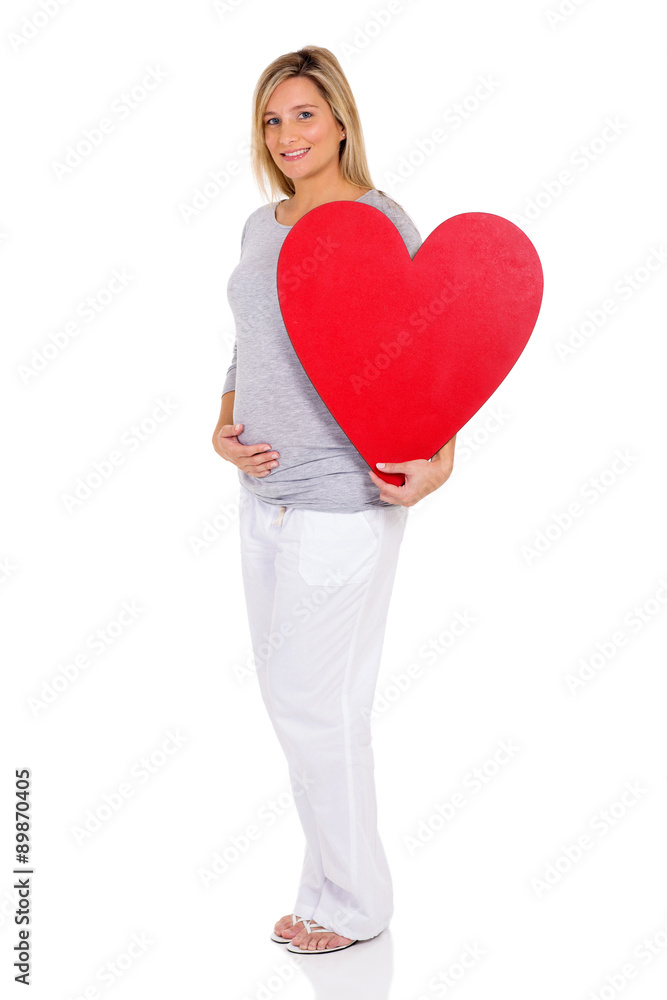 pregnant woman holding red heart pregnant woman holding red heart
