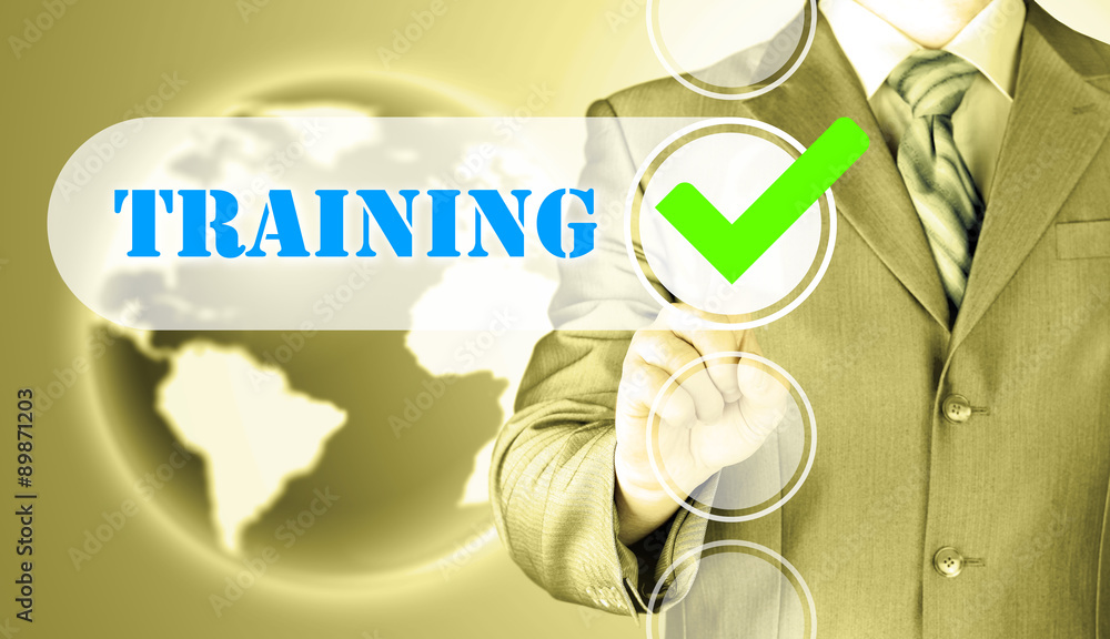 Businessman pressing touch screen interface training checkbox Businessman pressing touch screen interface training checkbox