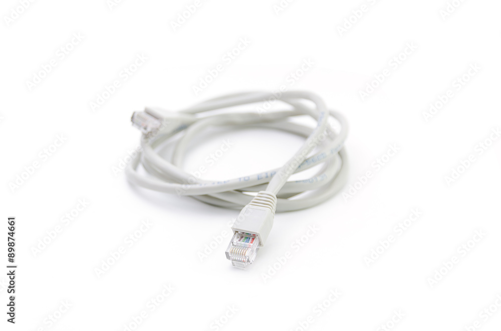 Close up of network cable and plugs on white background Close up of network cable and plugs on white background