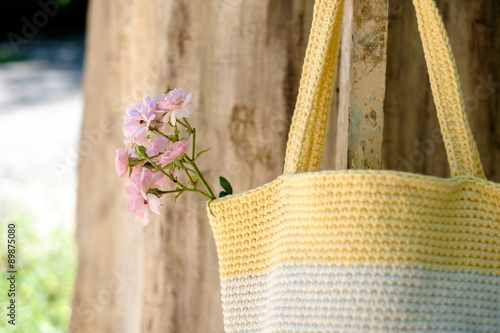 knitted crochet bag on the background of nature