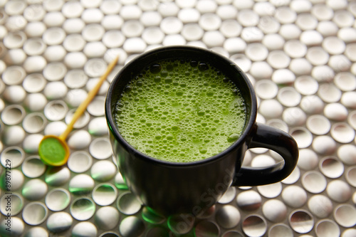 Matcha green tea from Japan on stainless steel photo