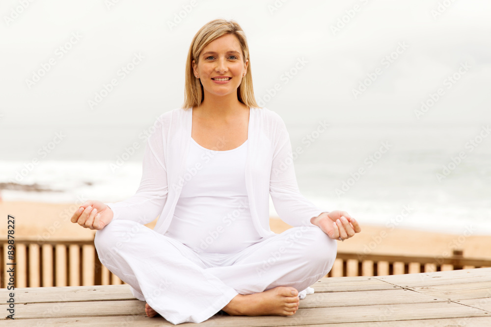 young pregnant woman meditating