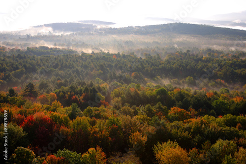 An aerial view of a hot air balloon floating over the Vermont country side ..