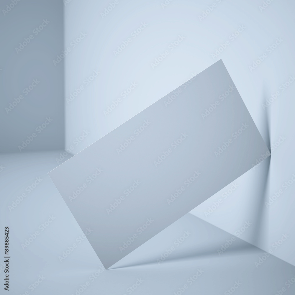 Fototapeta premium Biała pusta wizytówka blisko ściany