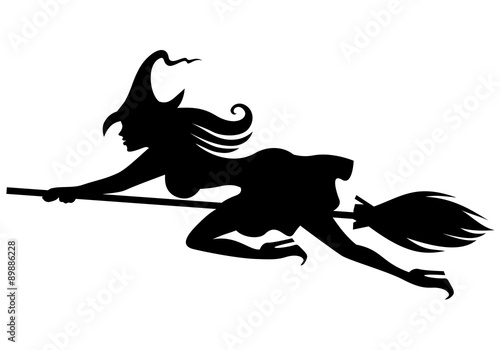 Silhouette witch on broomstick flying fast
