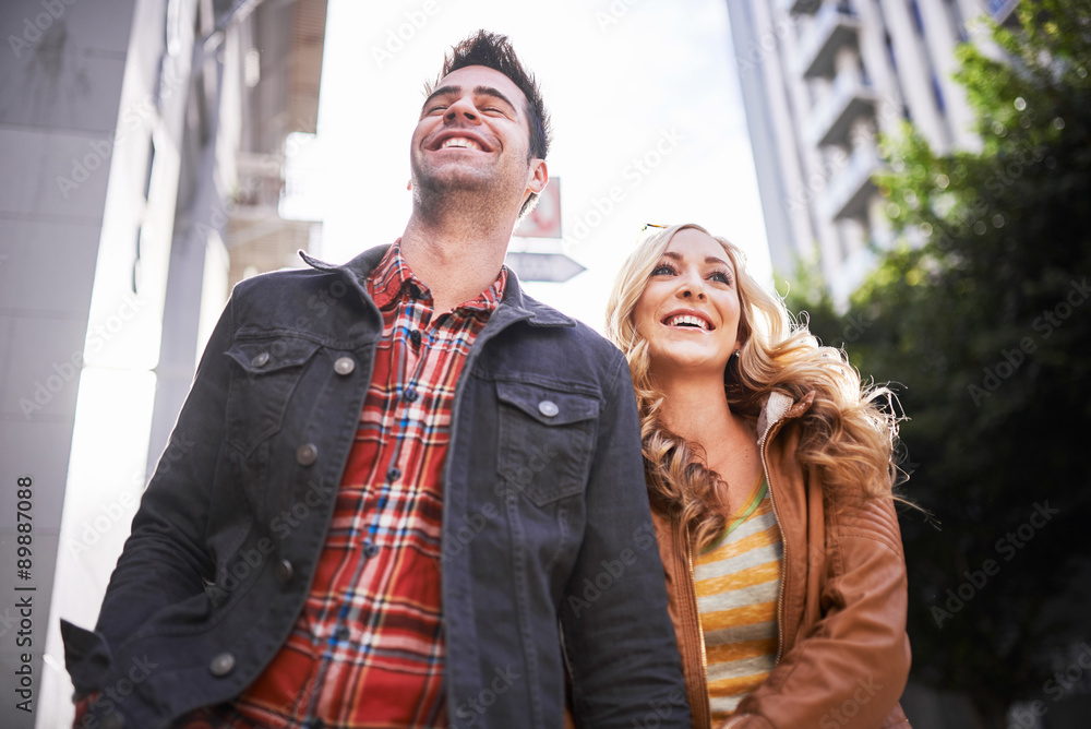 young romantic tourist couple walking down street in los angeles california young romantic tourist couple walking down street in los angeles california