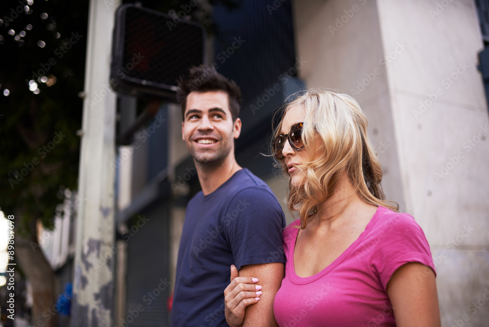 romantic tourist couple talking on street in LA romantic tourist couple talking on street in LA