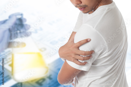 man having shoulder pain with research for use in drug treatment