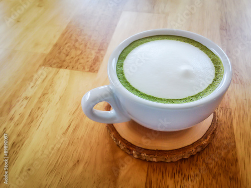 green tea latte on wood table