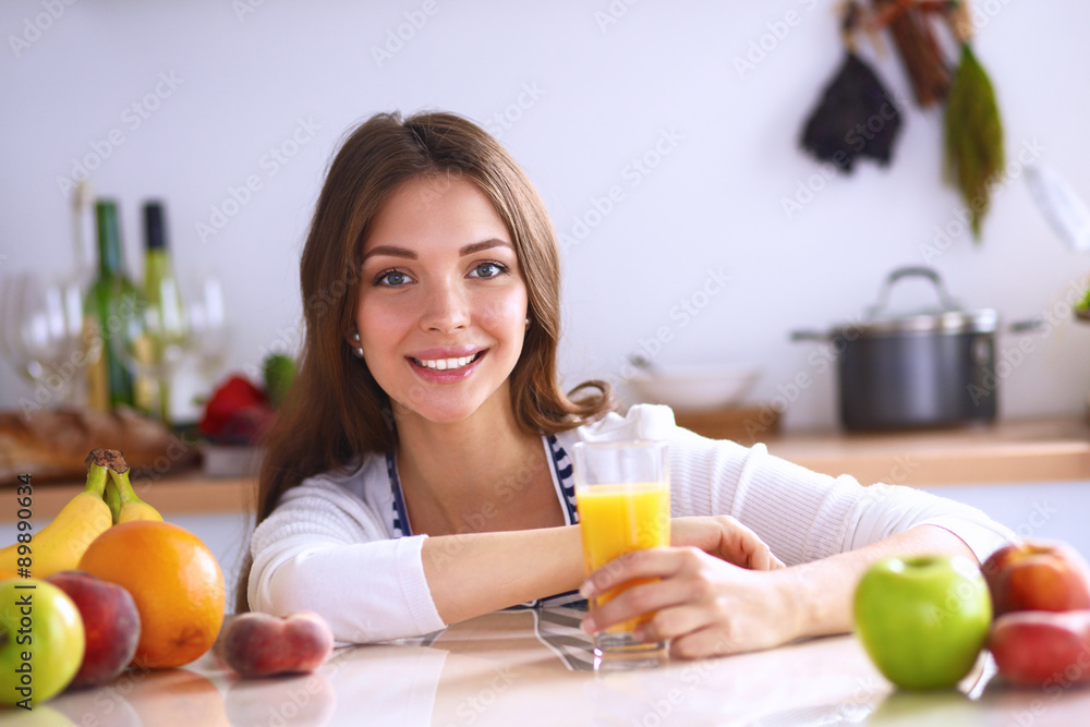 Portrait of a pretty woman holding glass with tasty juice Portrait of a pretty woman holding glass with tasty juice