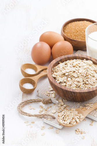 oat flakes and ingredients, vertical