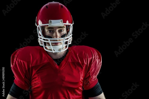 Portrait of american football player wearing his helmet