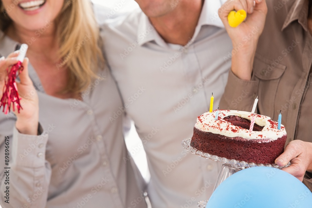 Casual business people celebrating birthday Casual business people celebrating birthday