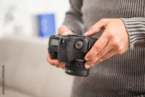 Close up view of hands holding camera