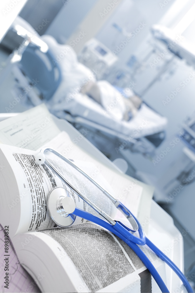 Stethoscope and a book in the ward. Concept of continuing medica Stethoscope and a book in the ward. Concept of continuing medica