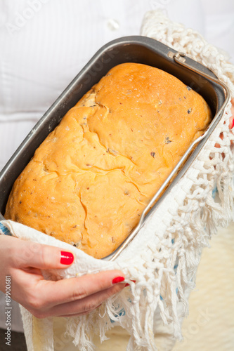 Female hands holding handmade bread photo