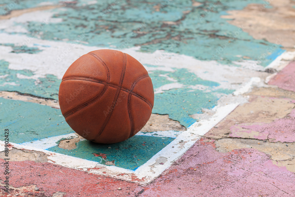outdoors basketball on old floor broken, selective focus