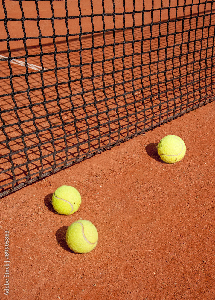 Tennis balls at the net