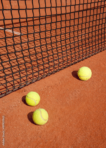 Tennis balls at the net © Vladimirs Koskins