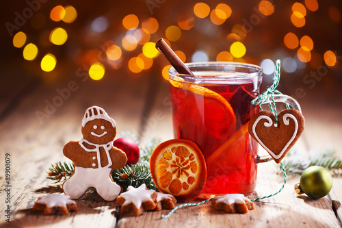 Christmas background with hot wine punch, cookies and smiling ginger bread man :)