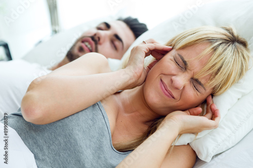 Billede på lærred Young woman who can not sleep because her husband snores.