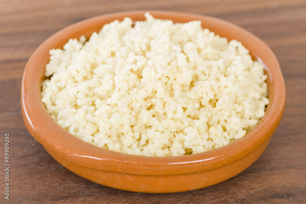 Couscous - Moroccan lemon couscous in a terracotta bowl.
Couscous - Moroccan lemon couscous in a terracotta bowl.