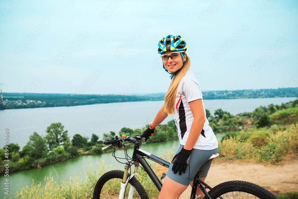 Young girl riding bicycle outside. Healthy Lifestyle. Young girl riding bicycle outside. Healthy Lifestyle.