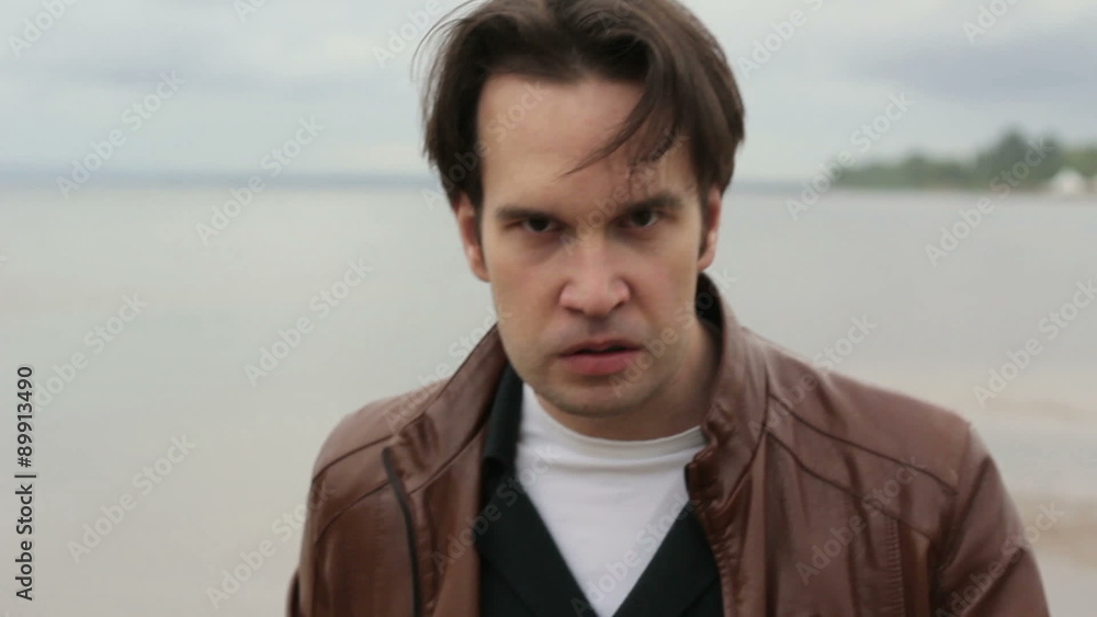 Portrait of a man with angry expression Portrait of a man with angry expression