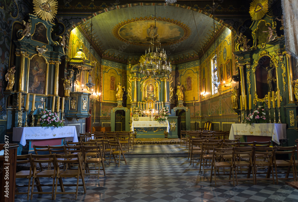 Fototapeta premium PODSTOLICE, CRACOW, POLAND - JUNE 30, 2015: Interior of the wooden antique church in Podstolice near Cracow. Poland