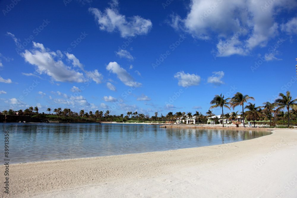 Sunny beach, puffy clouds and turquoise water. Paradise Island, Bahamas