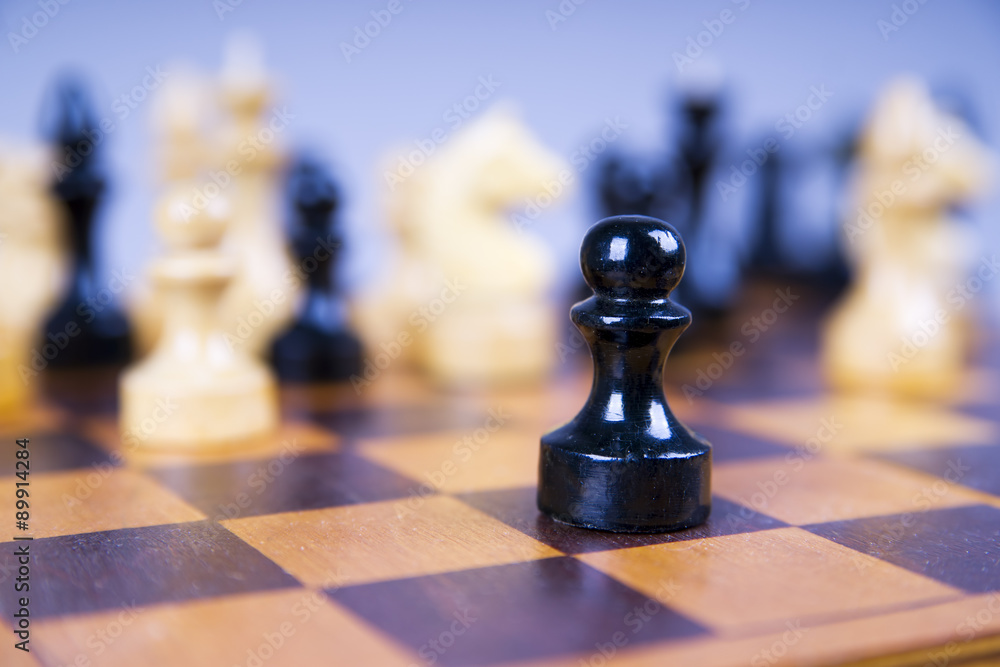 Concept with chess pieces on a wooden chess board Concept with chess pieces on a wooden chess board