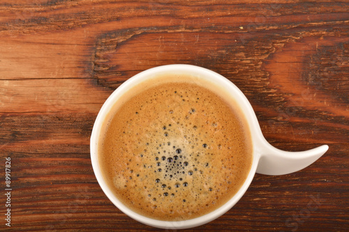 Coffee cup on wooden table