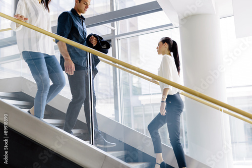 Group of businessman walking and taking stairs