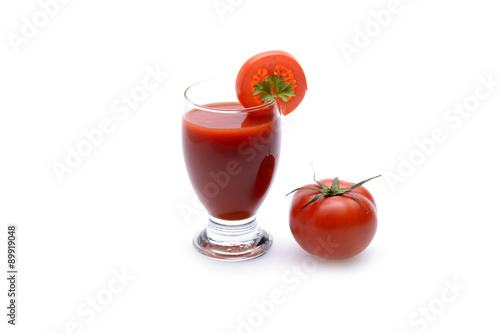 Fresh tomato juice on white background