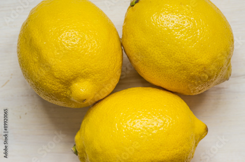 Three ripe lemons on the table