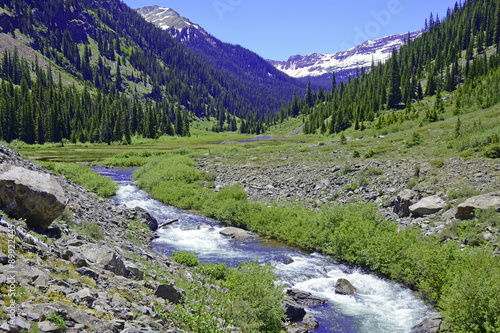 Alpine landscape with fly fishing stream in the Elk Range, Rocky Mountains, Colorado
