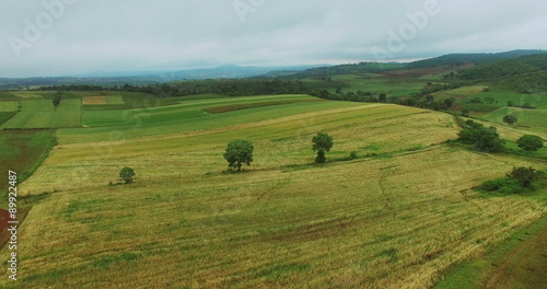 Aerial view flying over camping on hill in Tanzania savanna Landscape. Africa. Travel tourism adventure from bird eye view.
