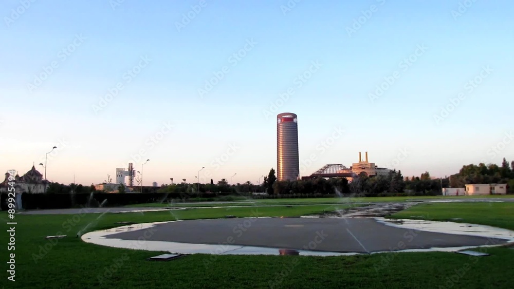 Panoramic view of the Pelli tower of Seville, from the heliport, with sprinklers running in Seville, Spain Panoramic view of the Pelli tower of Seville, from the heliport, with sprinklers running in Seville, Spain