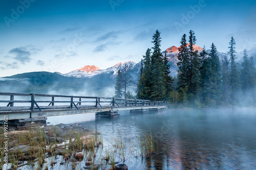 Canadian Landscape: Misty Sunrise at Pyramid Lake in Jasper, Alberta photo
