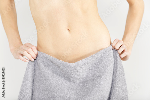 Womans waist with towel wrapped around