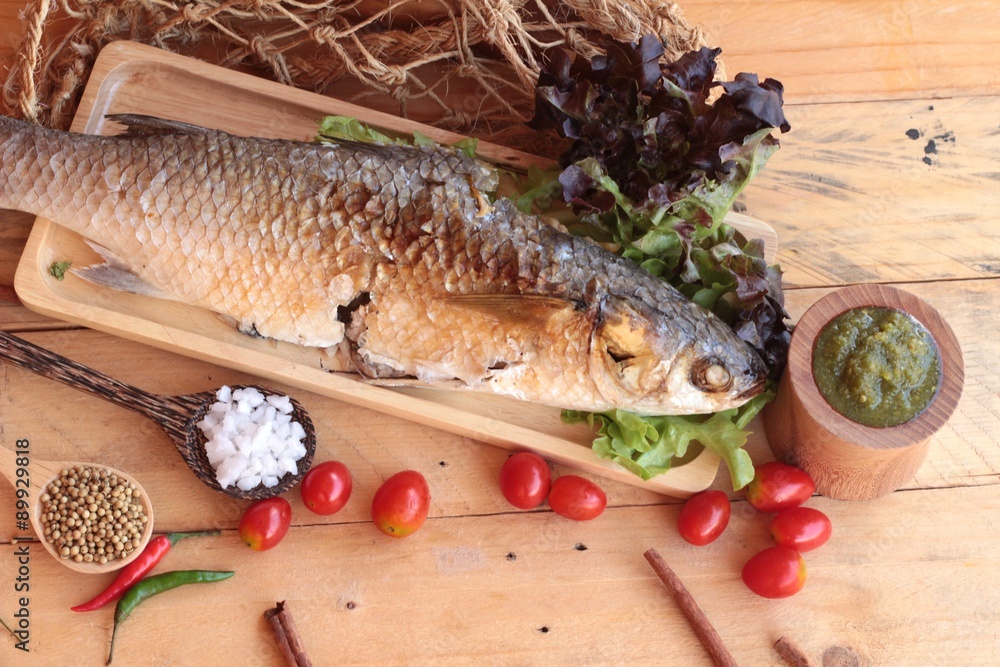 Grilled fish of salt with spicy sauce delicious. Grilled fish of salt with spicy sauce delicious.