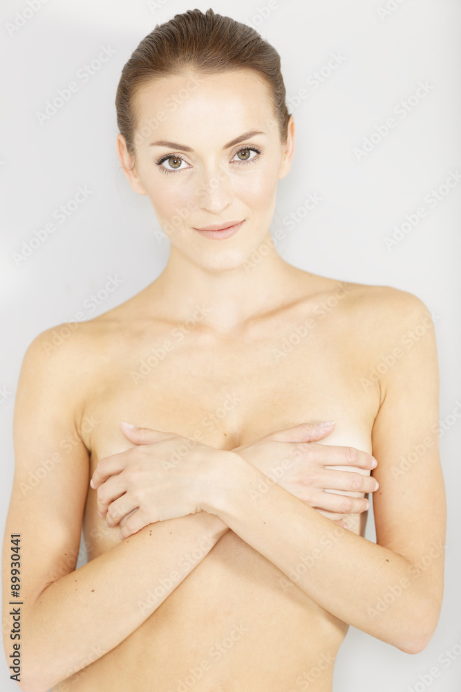 Obraz premium Woman covering her chest smiling