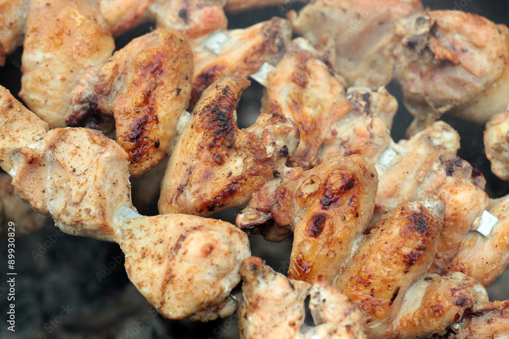 Chicken on the grill to cook